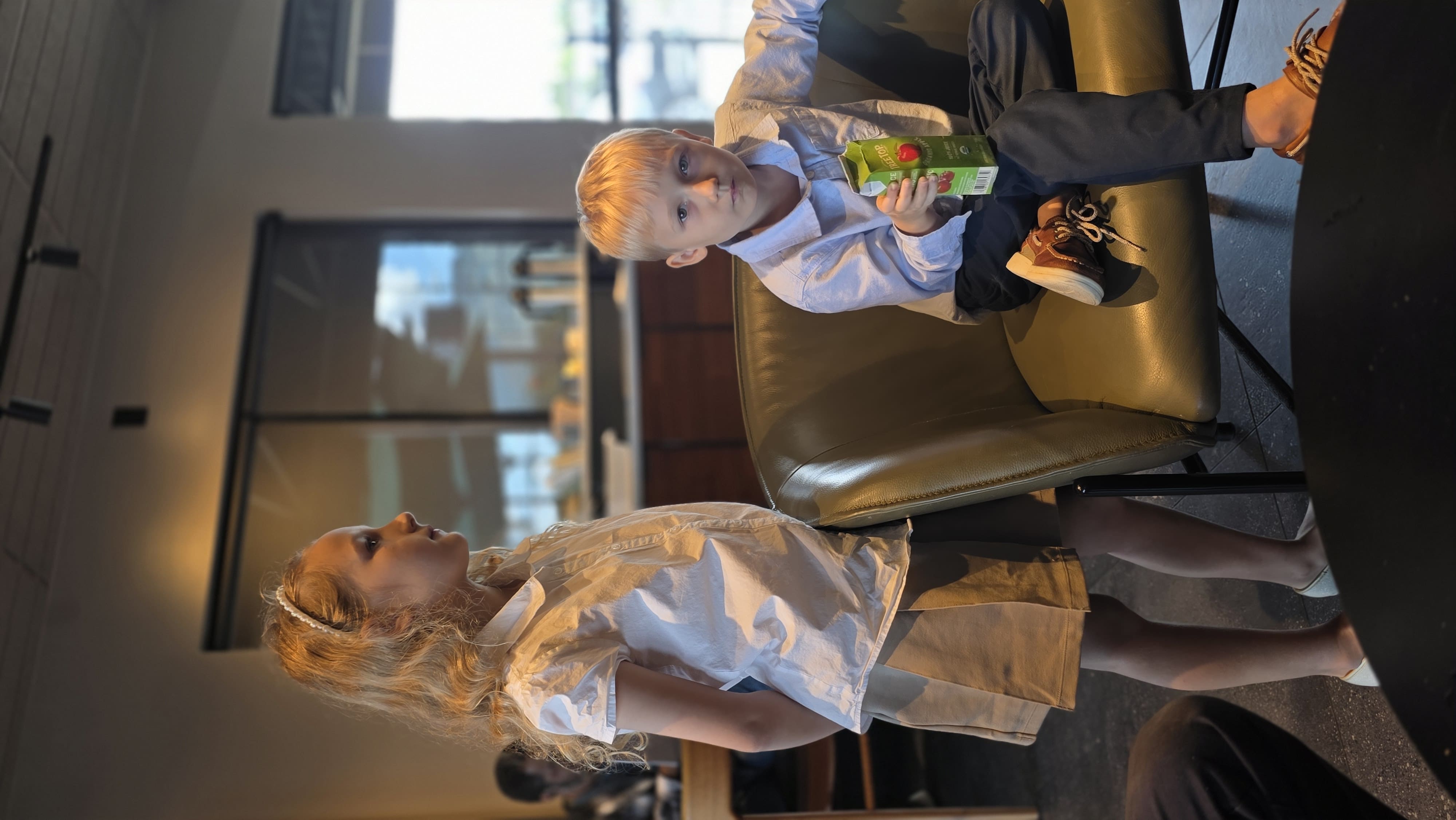 Two children sharing an ordinary family outing