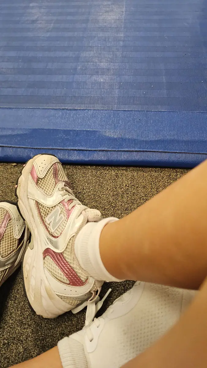 Child wearing everyday sneakers that are cleaned as part of the family shoe routine