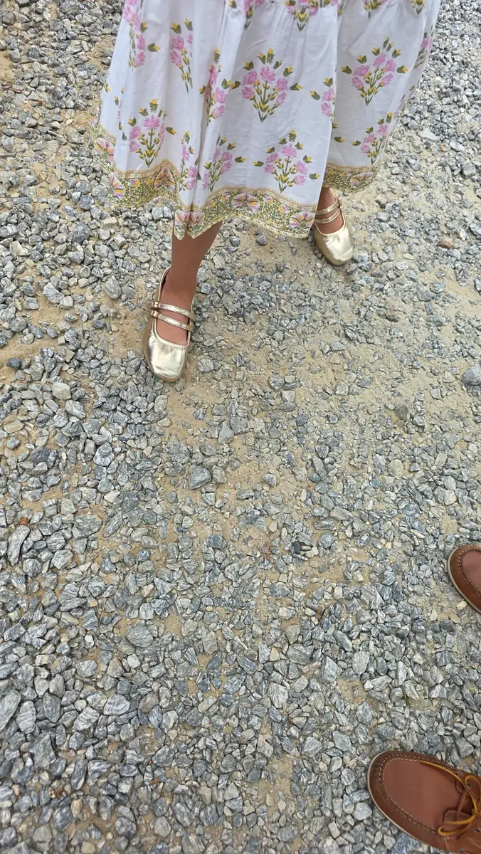 Outdoor shoes worn by a family while walking on gravel before returning home